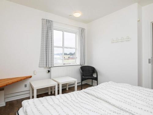 a bedroom with two beds and a desk and a window at Type2 holiday home in Hanstholm in Hanstholm