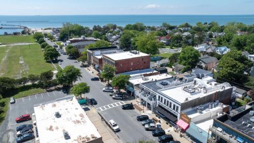 an aerial view of a small town with a parking lot at Virginia Lee - Brand new condo in downtown Cape Charles! in Cape Charles