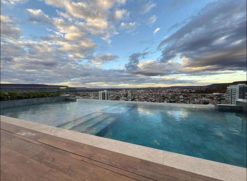 a large swimming pool on top of a building at Studio 303, new, with complete furniture in Barreiras