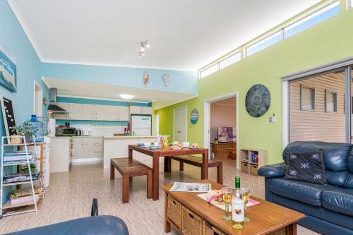 a living room with a couch and a table at Break-A-Way - Coastal comfort in lancelin in Lancelin