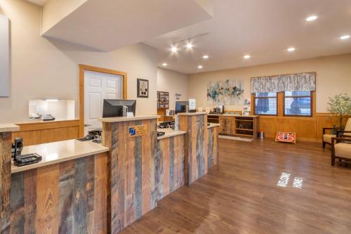 an office with wooden counter tops and a desk at Fairway Forest in Sapphire