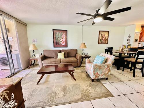 a living room with a couch and a table at Menehune Shores 227 condo in Kihei