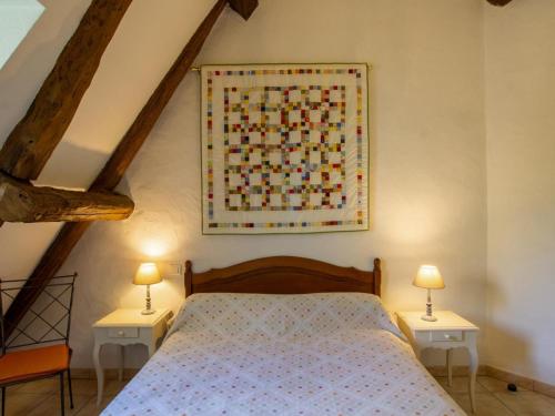 Una cama o camas en una habitación de Maison typique du Périgord avec jardin clos, proche de Sarlat et activités familiales - FR-1-616-98