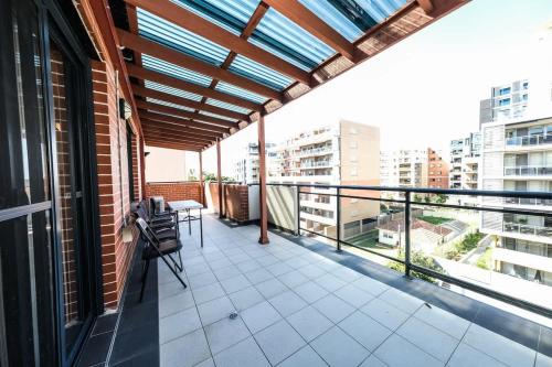 a balcony with a view of a building at Two Level 3 Bedroom Penthouse in Sydney Liverpool in Liverpool
