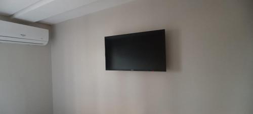 TV a/nebo společenská místnost v ubytování Hotel New Brás
