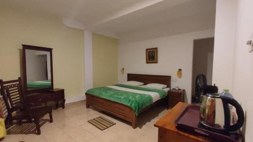 Ένα ή περισσότερα κρεβάτια σε δωμάτιο στο Blue sky Guest House and Restaurant