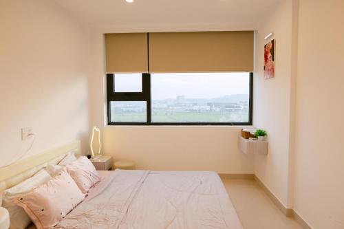 Katil atau katil-katil dalam bilik di PucPu Homestay 2 Nera Garden Huế