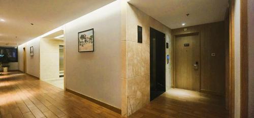 a hallway of a building with wooden floors and a door at Muong Thanh Grand Saigon Centre Hotel in Ho Chi Minh City