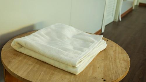 a pile of white dough sitting on a wooden table at Airport Bangkok Villa in Ban Hua Takhe