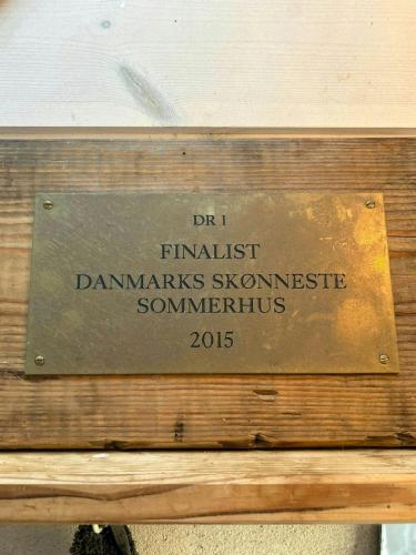 a sign that reads danishanishammaries shandonsteensteensteensteensometimes at Beach House In The Dunes At Tornby Strand in Hirtshals