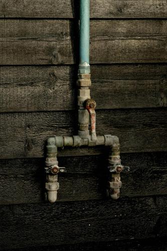 a pipe attached to the side of a building at Beach House In The Dunes At Tornby Strand in Hirtshals