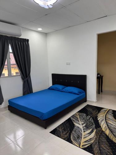 Ένα ή περισσότερα κρεβάτια σε δωμάτιο στο Nilam Puri