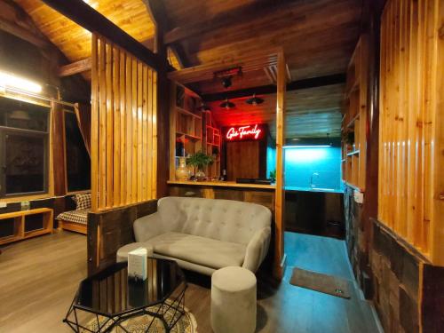 a living room with a couch and a table at Gio Homestay & Bungalow Sapa in Sa Pa
