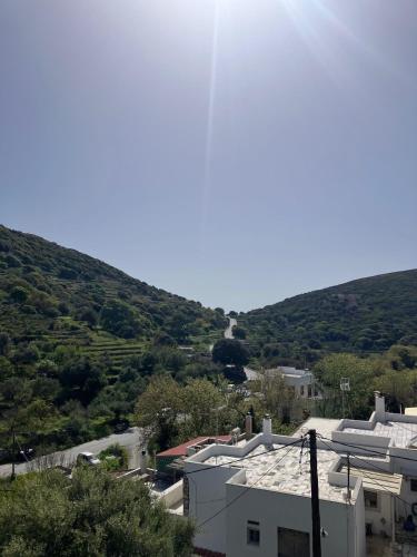 a view of a city with hills in the background at Kalliopis view , Kinidaros in Kinídharos