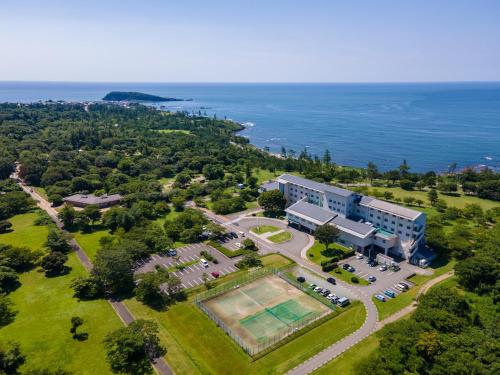 an aerial view of a building with a tennis court at Kyukamura Echizen-Mikuni in Sakai