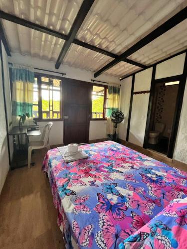 Ένα ή περισσότερα κρεβάτια σε δωμάτιο στο Casa Waka Marú