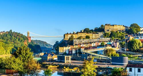 a view of a city with a bridge in the background at Spacious 4-Bed Bristol | WiFi | Parking | Workspace in Bristol