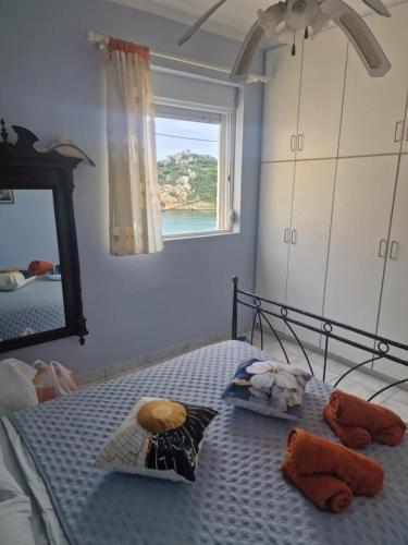 a bedroom with a bed with two stuffed animals on it at Emporios Mansion in Emporeiós