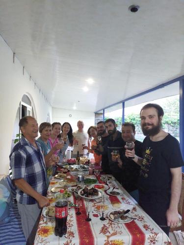 a group of people standing around a long table at Vacation Home in Ashtarak in Ashtarak
