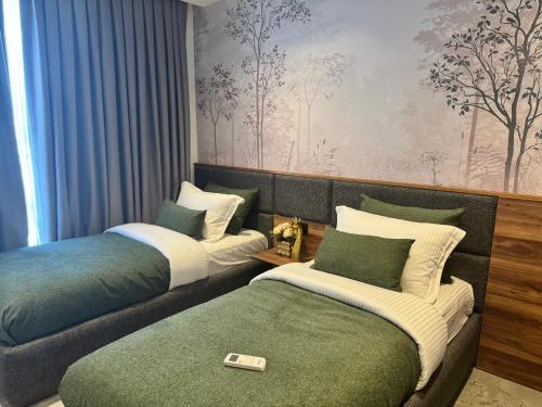 Katil atau katil-katil dalam bilik di Nordic Art - Premium apartment by the sea