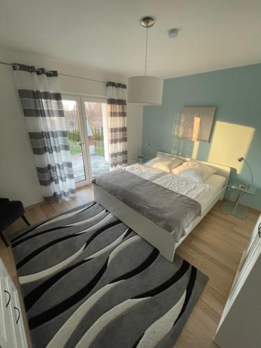 a bedroom with a bed and a zebra rug at Villa WoW in Zastań