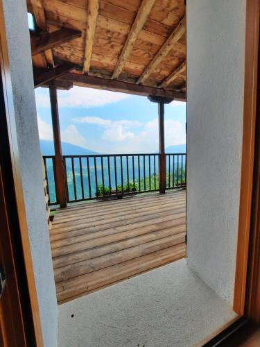 a view from a door of a deck with a view at B&B Val Maschi in Lamon