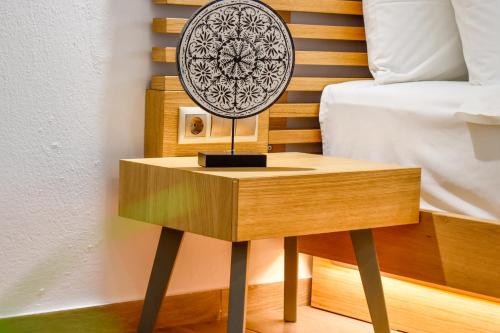 a table with a fan on it next to a bed at Giabeos Skiathos in Troulos