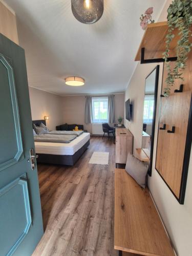 a living room with a bed and a room with at Lindengut Natternbach in Natternbach