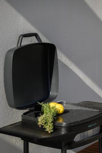 a computer monitor sitting on top of a table at Muse by the beach with Jakuzzi in Amoudara Lasithiou