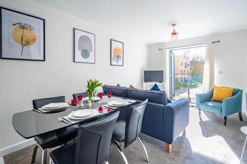 a dining room and living room with a table and chairs at Serviced Lettings 2 Bedrooms Central Location On site Parking in Norwich