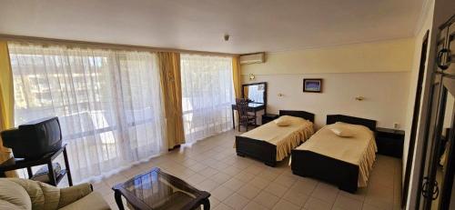 Postel nebo postele na pokoji v ubytování Hotel Klisura