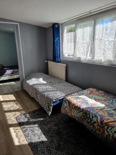 Postel nebo postele na pokoji v ubytování Logement à 100m de la mer