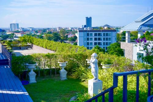 a statue on the roof of a building at D Eco Wellness Center in North Pattaya