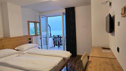 Ένα ή περισσότερα κρεβάτια σε δωμάτιο στο Lago Park Hotel