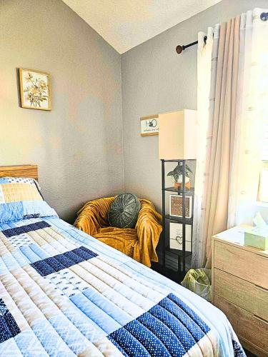 a bedroom with a bed with a pillow on it at Minsa - Peaceful Home near LAX DTLA & Free Parking in Lawndale