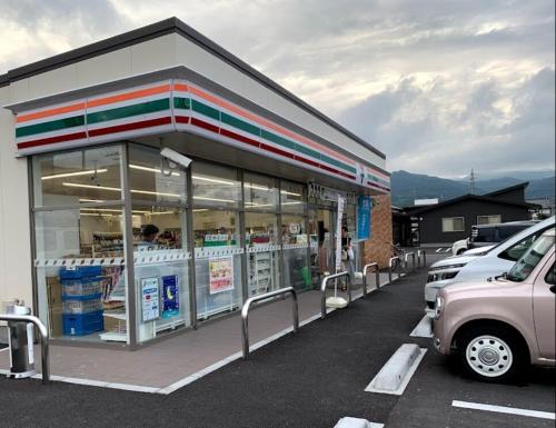 a gas station with a car parked in front of it at 逸仙居 Japanese Style House in Fuefuki