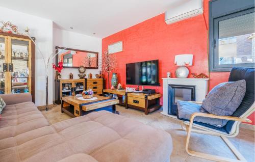 a living room with a couch and a fireplace at Pet Friendly Home In Segur De Calafell in Segur de Calafell