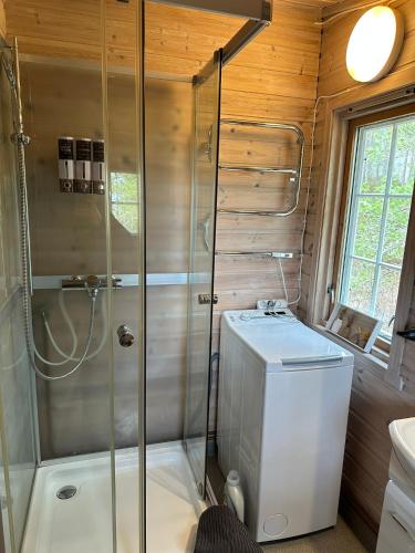a bathroom with a shower and a toilet at Tonstad hytta in Tonstad