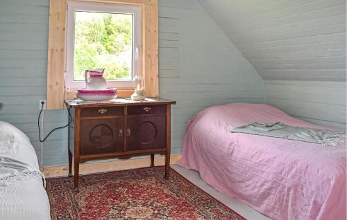 a small bedroom with a bed and a window at 3 Bedroom Beautiful Home In Jämshög in Jämshög