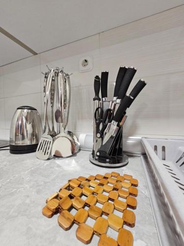 a counter top with a bunch of food and utensils at Mother Teresa Apartments in Skopje