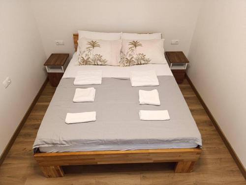 a bedroom with a large bed with white sheets and pillows at bb resorts in Kosor