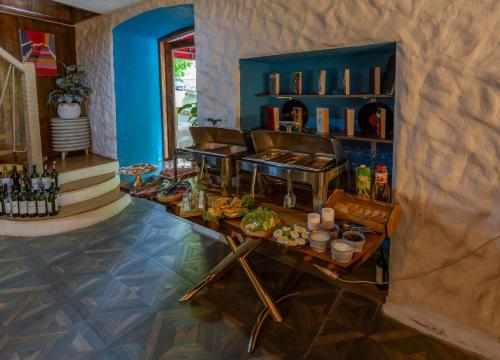 a room with a table with food and drinks at Hillside Boutique Hotel Baku in Baku