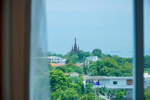 a view of a city from a window at D Eco Wellness Center in North Pattaya
