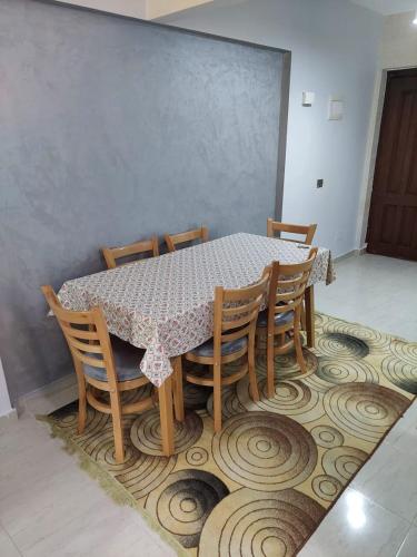 a table and chairs with a table and a table and a table and a table at شاليه مميز بقريه مارينا دلتا السياحيه olooool8369 in Al Ḩammād