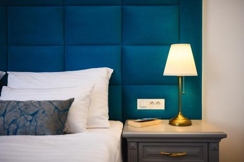 Ein Bett oder Betten in einem Zimmer der Unterkunft Boutique Hotel Golden Key - Poreč - Bed & Breakfast