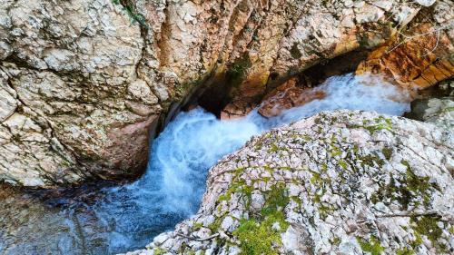 an aerial view of a river flowing through a canyon at Cottege in Pietra sul Fiume in Frontone