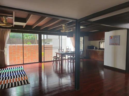 a kitchen and dining room with a table and chairs at AT ASok Vintage House Near BTS Asok MRT Sukhumvit in Khlong Toei