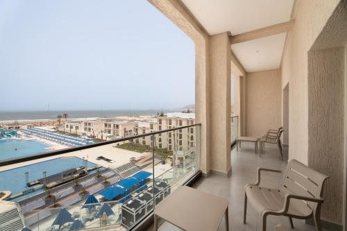 a balcony with a view of a pool at Pickalbatros Palais Des Roses - Agadir - All Inclusive in Agadir