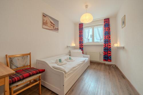 Postel nebo postele na pokoji v ubytování Viktoria A22 by Arosa Vacations, Familienwohnung im Zentrum mit Bergblick