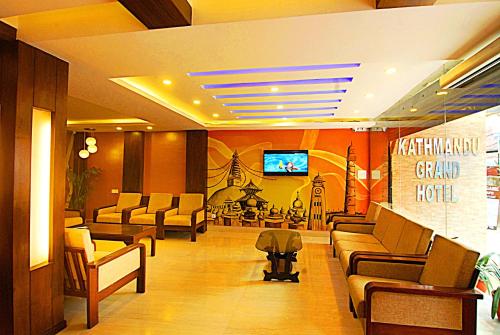 a waiting room with couches and a tv in a hospital at Kathmandu Grand Hotel in Kathmandu